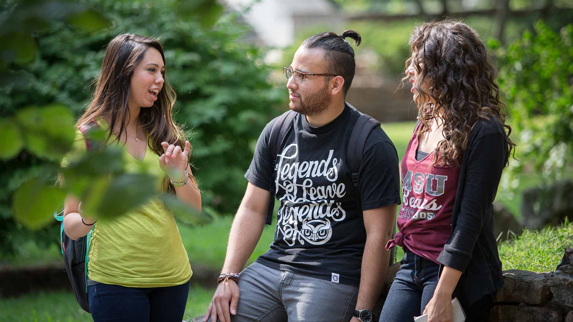 Students talking at campus courtyard.
